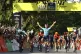 Mark Cavendish (centre) celebrates after crossing the finish