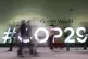 People walk through the COP29 U.N. Climate Summit, November 