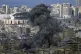 Smoke rises after an Israeli airstrike on Dahiyeh, in the so