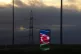 A screen displaying the Azerbaijan flag sits near power line