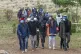 Volunteer rescue workers and community members leave the are