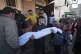 Palestinians mourn nine people killed in an Israeli strike i