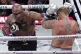 Mike Tyson lands a left to Jake Paul during their heavyweigh