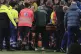 Medics carry Hungary's assistant coach Adam Szalai from the 