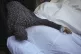 A woman mourns over the bodies of victims from an Israeli ai