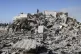 Residents of a building damaged in an Israeli airstrike retu