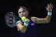 Britain's Emma Raducanu returns the ball to Slovakia's Vikto