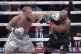 Jake Paul lands a left to Mike Tyson during their heavyweigh