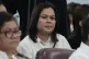 Philippine Vice President Sara Duterte listens as she attend