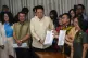 House Secretary General, Reginald Velasco (centre) receives 