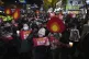 Protesters march to the presidential office after a candleli