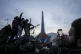 Palestinians survey the aftermath of an Israeli air strike o