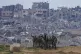 Israeli female soldiers pose for a photo on a position on th