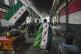 Opposition supporters carry opposition flags along the Al-Ha