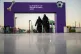 Women walk in front of a fan zone during the Club World Cup 