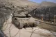An Israeli tank manoeuvres next to the security fence near t