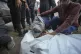 Sahar Mohanna mourns over the body of her brother, a victim 