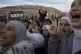 People gather to celebrate days after the fall of Bashar Ass