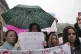 Students stopping traffic, stand in silence during ongoing p