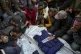 Relatives and friends mourn over the bodies of five Palestin