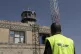 A man looks at the damage in the control tower of Sana'a Int
