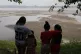 Residents look out at the Madeira River, a tributary of the 
