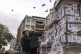 Young men inspect portraits of missing people whose families