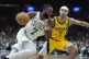 Boston Celtics guard Jaylen Brown drives toward the basket i