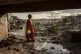 A young girl walks in the Kaweni slum on the outskirts of Ma