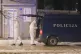 Police investigators work at the site of a shooting in Cetin