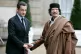 French President Nicolas Sarkozy (left) greets Libyan leader