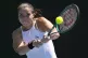 Jodie Burrage of Britain plays a backhand return to Leolia J
