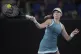 Katie Boulter of Britain plays a forehand return to Rebecca 