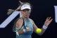 Katie Boulter of Britain plays a forehand return to Veronika