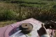 An unexploded land mine (left) on a table at a clearance sit