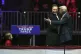 Elon Musk, with his son X Æ A-Xii, arrives on the dais with