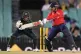 England's Sophie Dunkley (right) bats in front of Australia'