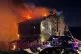 Firefighters work to extinguish a fire in a hotel at a ski r