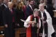 US President Donald Trump (left) watches as Reverend Mariann