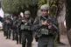 Police patrol in Tibu, Colombia, Tuesday, Jan. 21, 2025, fol
