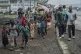 People displaced by the fighting with M23 rebels make their 