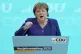 Former German Chancellor Angela Merkel delivers a speech dur