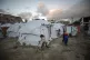 Children play at a tent camp for displaced Palestinians in G