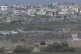 An Israeli tank takes a position near the border with Gaza i