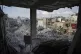 Devastation around the Saleh family home is seen through des