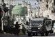 Israeli forces take position during an army operation in the