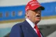 President Donald Trump speaks to reporters after landing at 