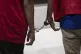 Two men convicted of having gay sex stand handcuffed togethe