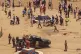 In this video frame grab, people assist victims after two ex