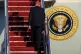 US President Donald Trump walks up the stairs to board Air F